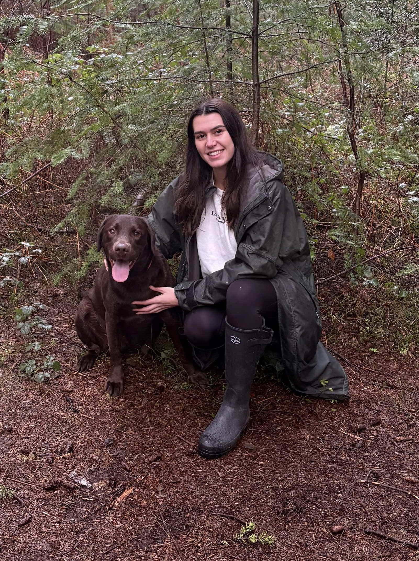 Image of person and dog in a forest